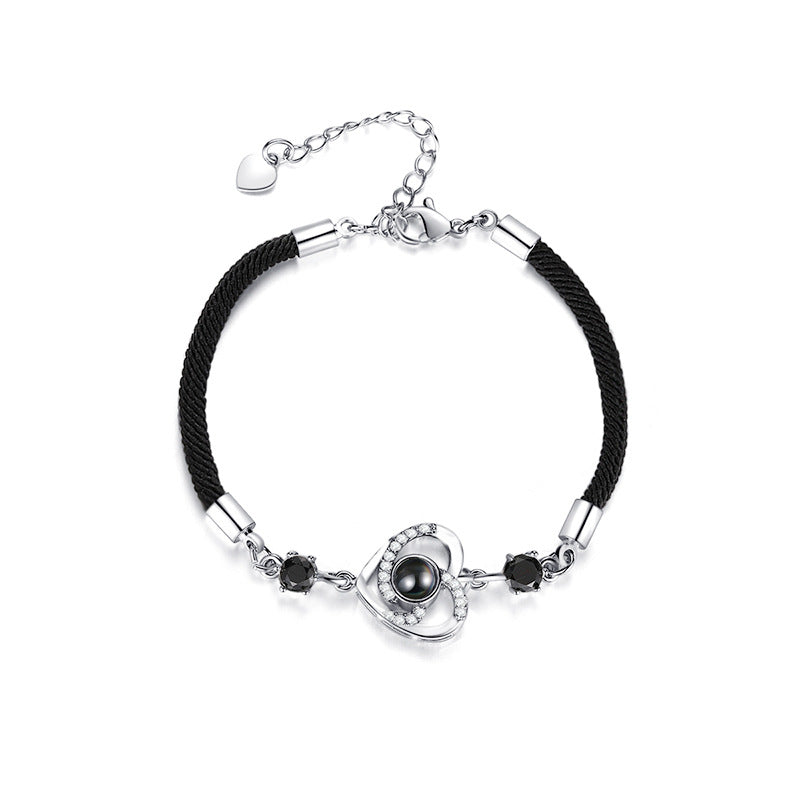 Custom projection bracelet with "I Love You" in 100 languages, perfect for couples. Personalize with engraving for a meaningful gift.
