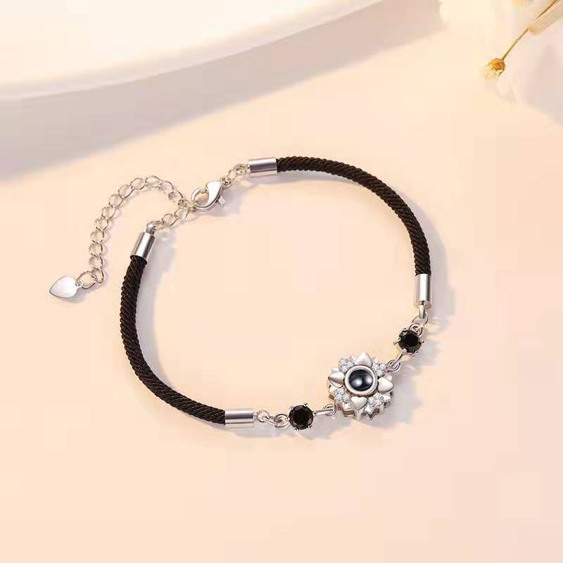 Customizable couple projection bracelets with braided design, perfect as a personalized gift.