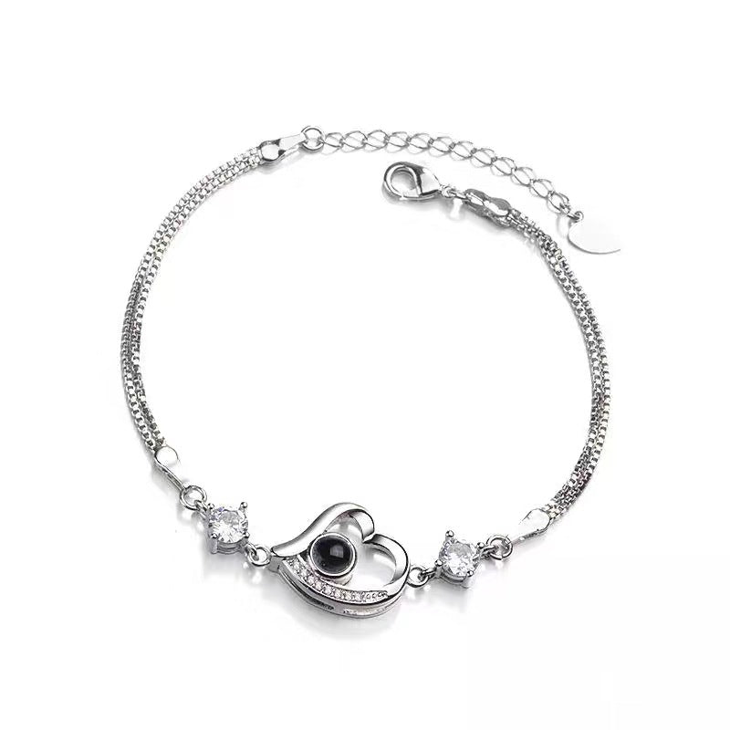 "100 Languages 'I Love You' Projection Bracelet – a perfect gift for your girlfriend, ideal for birthdays or special occasions."