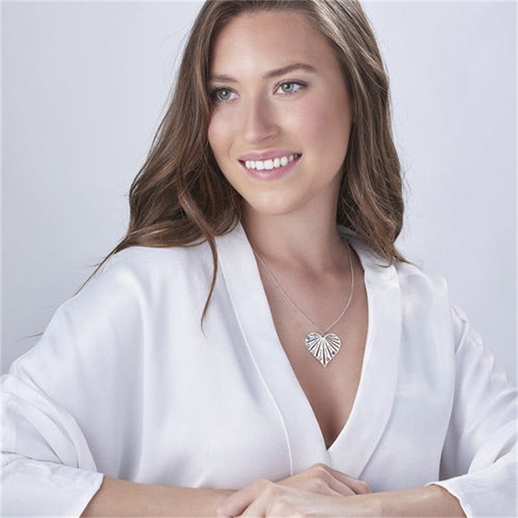 Women's diamond collarbone necklace with name lettering and peach heart design, perfect for MOM.