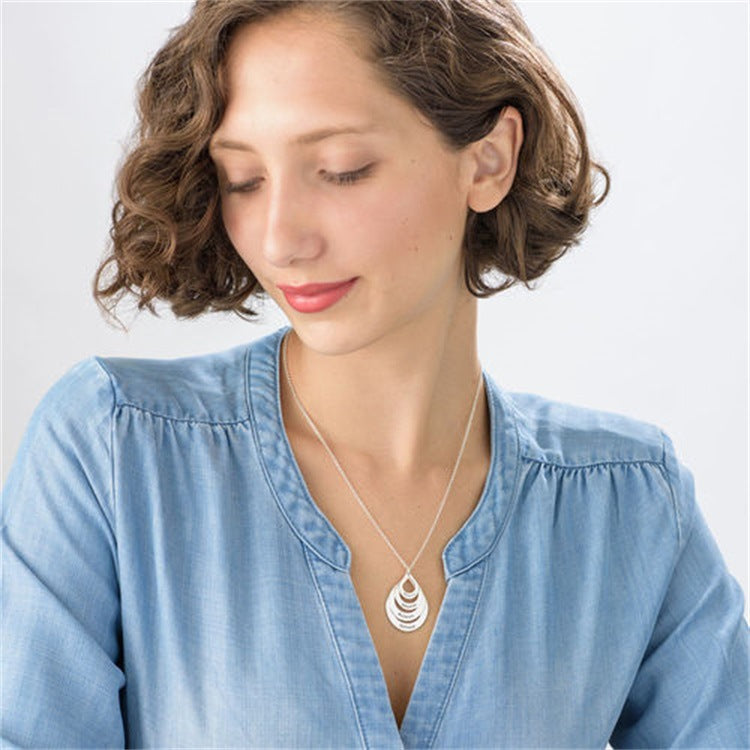 Custom 925 silver round necklace with lettering for couples, perfect Valentine's Day gift.