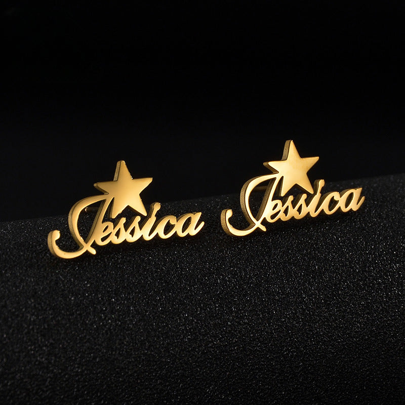 Trendy stainless steel name stud earrings with diamond accents and cut-out letter design.