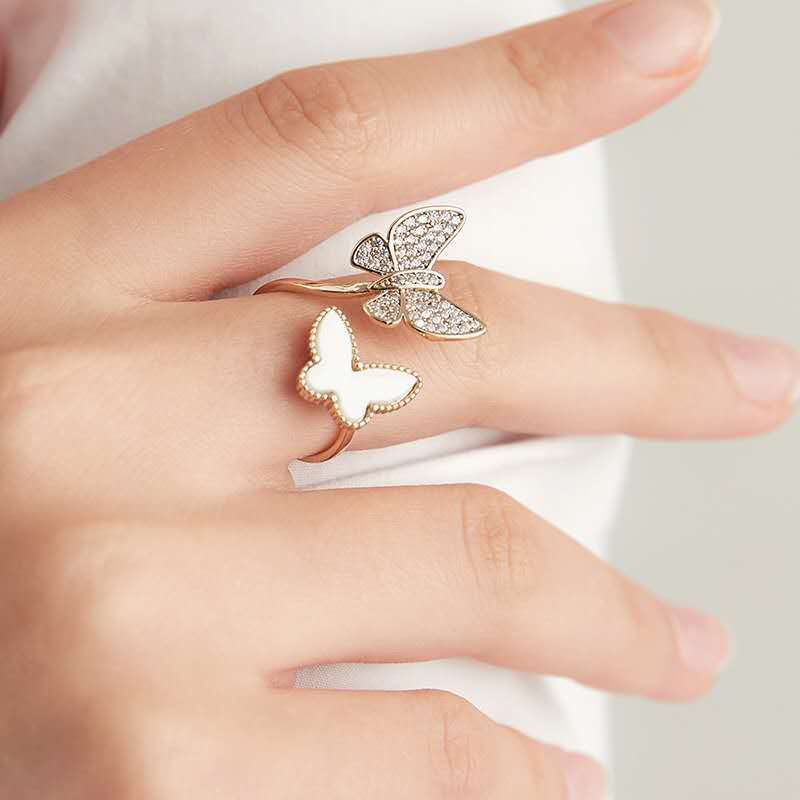 Stylish rhinestone double butterfly ring with an open adjustable design. Perfect for adding a unique, elegant touch to any look.