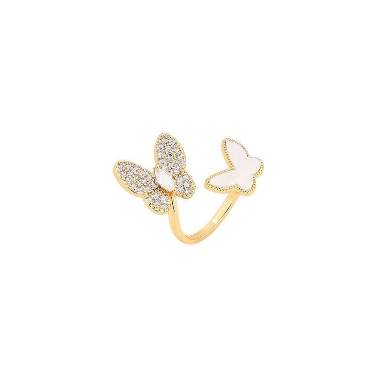 Stylish rhinestone double butterfly ring with an open adjustable design. Perfect for adding a unique, elegant touch to any look.