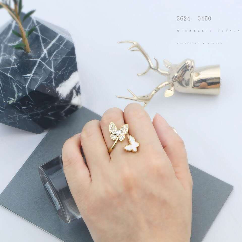 Stylish rhinestone double butterfly ring with an open adjustable design. Perfect for adding a unique, elegant touch to any look.