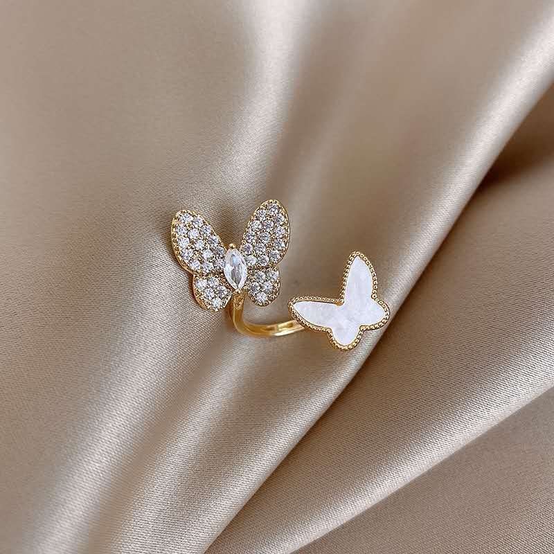 Stylish rhinestone double butterfly ring with an open adjustable design. Perfect for adding a unique, elegant touch to any look.