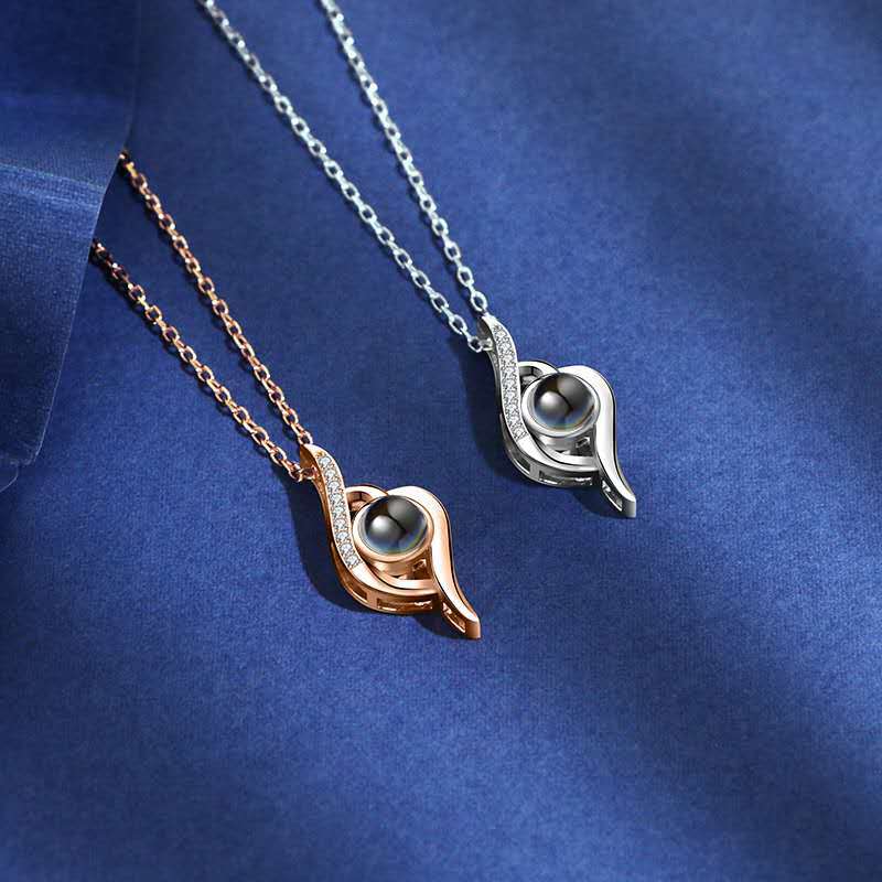 Custom projection necklace with "I Love You" in 100 languages. Perfect for Valentine’s or anniversaries.