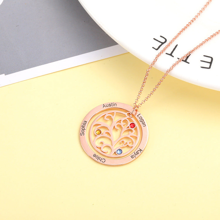 Custom silver birthstone necklace with tree of life design, geometric style and personalised engraving.