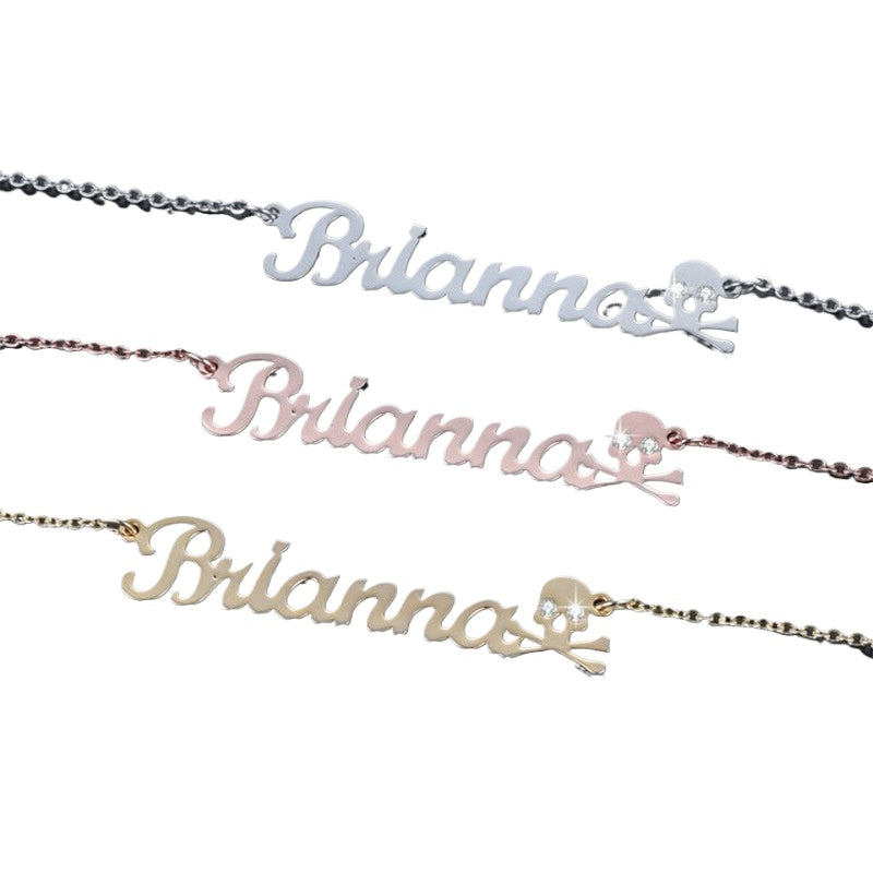 Crystal Skull Name Necklace with Pirate Design and Shimmering Eyes – Dazzling Jewelry.