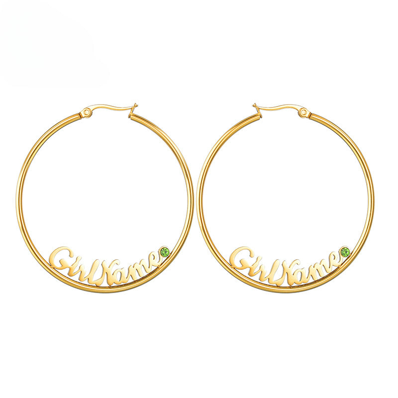 Hot-selling large round stainless steel letter name hoop earrings with rhinestone accents for women.