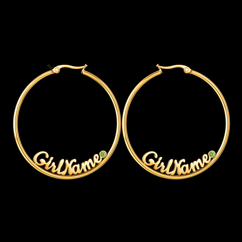 Hot-selling large round stainless steel letter name hoop earrings with rhinestone accents for women.
