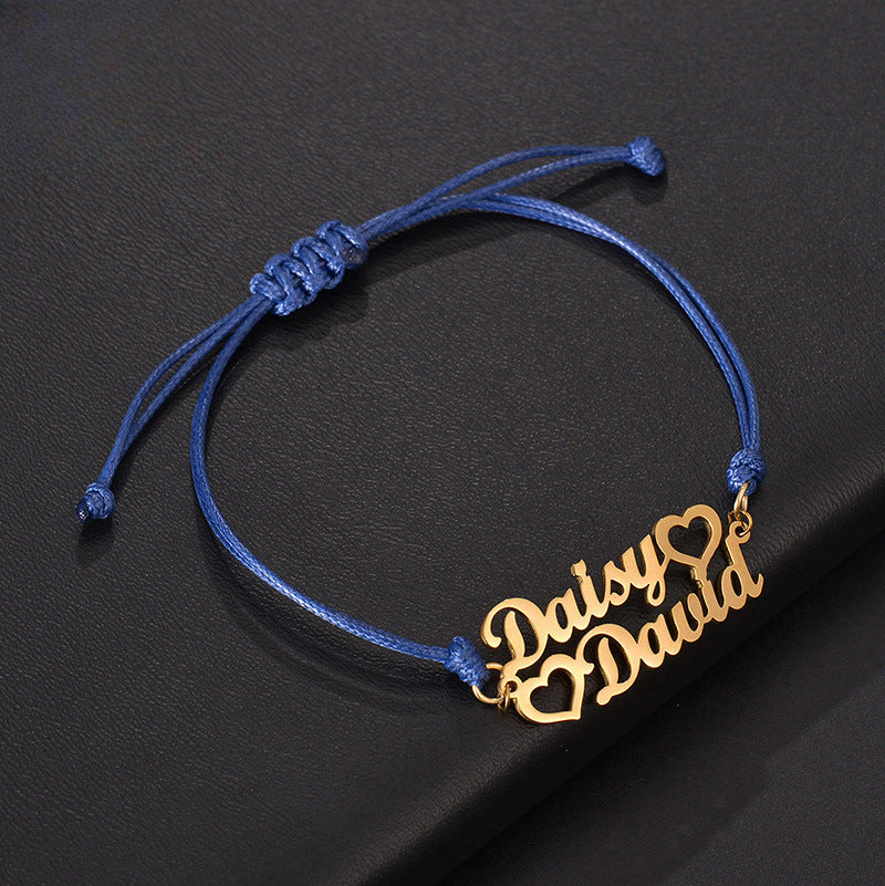 Custom stainless steel name bracelet with adjustable cord. Perfect for couples with personalized letter design.