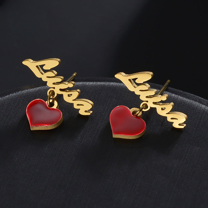 Custom name stud earrings with stainless steel letter and enamel heart. Perfect gift.