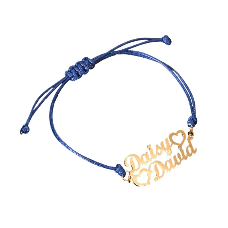 Custom stainless steel name bracelet with adjustable cord. Perfect for couples with personalized letter design.