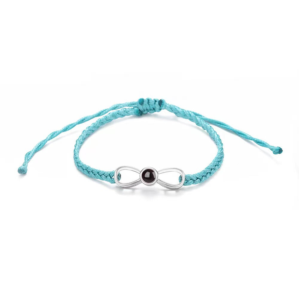 Korean-style bow braided bracelet with 100-language "I love you" photo projection, customizable for couples.