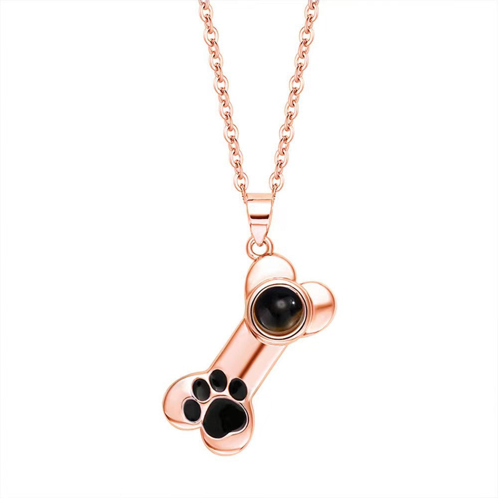 100 Languages "I Love You" projection bone necklace with dog paw design, perfect pet-themed Christmas gift.