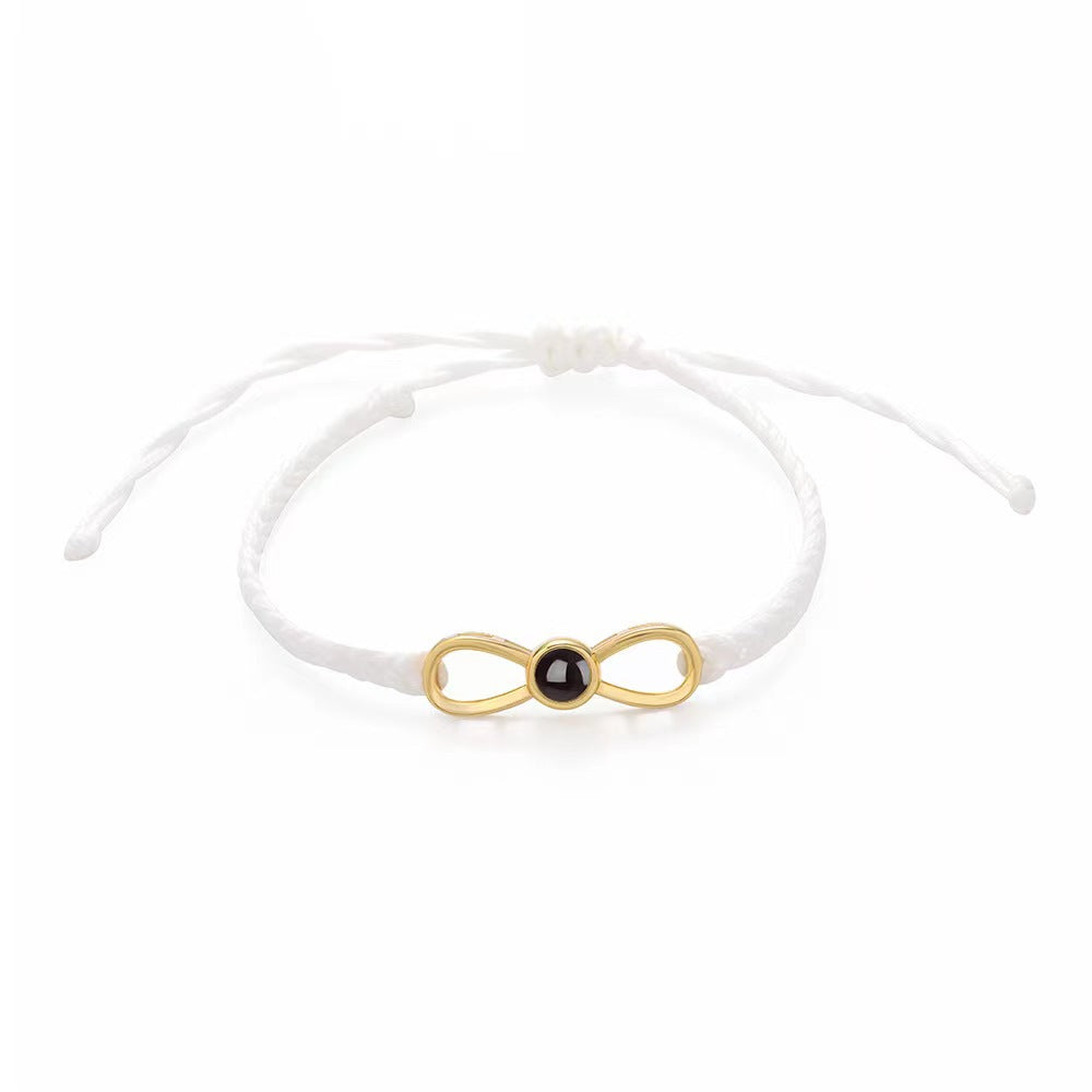 Korean-style bow braided bracelet with 100-language "I love you" photo projection, customizable for couples.