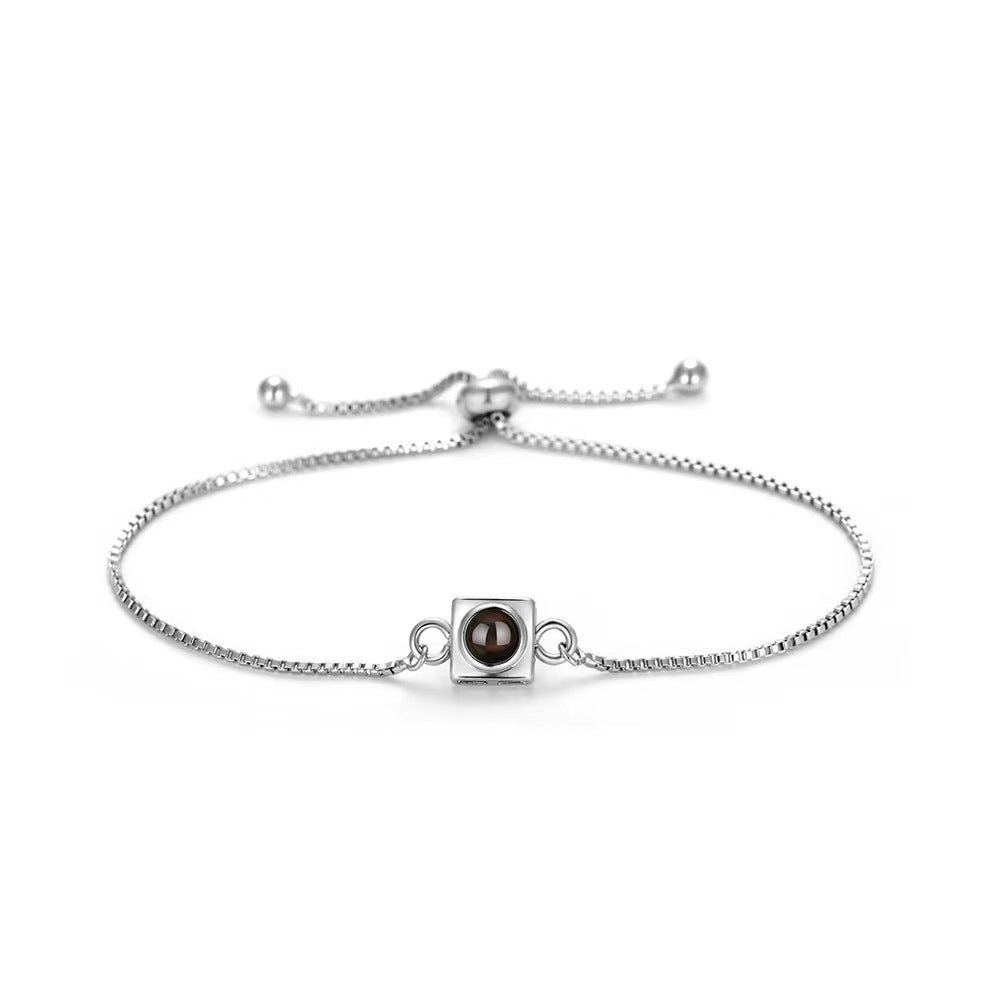 Trending square box sliding bracelet with photo projection and "I love you" in 100 languages.