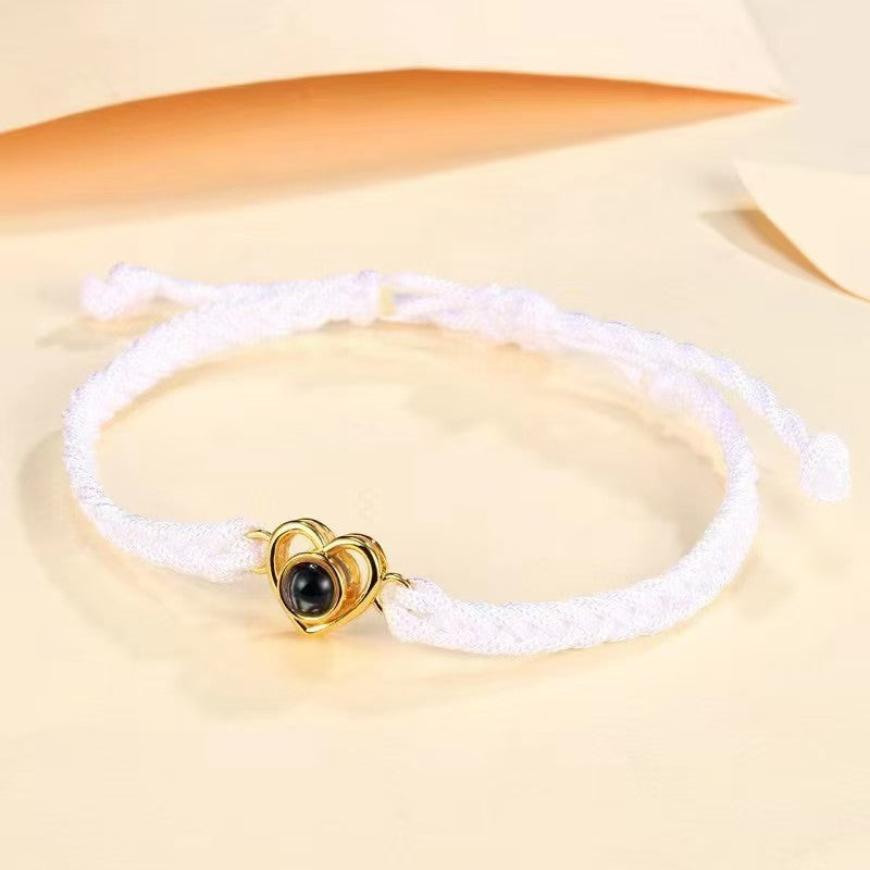 Popular heart woven bracelet with "I love you" in 100 languages projection, Korean-style minimalist design.