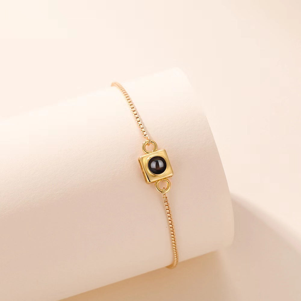 Trending square box sliding bracelet with photo projection and "I love you" in 100 languages.