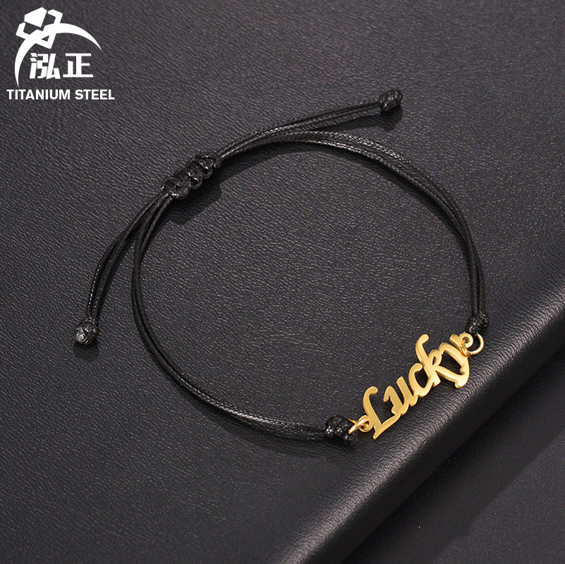 Custom stainless steel name bracelet with adjustable cord. Perfect for couples with personalized letter design.
