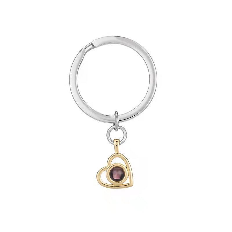 Titanium steel necklace featuring 100 languages "I love you" projection. Customizable with nano-printed photos, this unique piece is a perfect Valentine's Day or Qixi Festival gift for her.