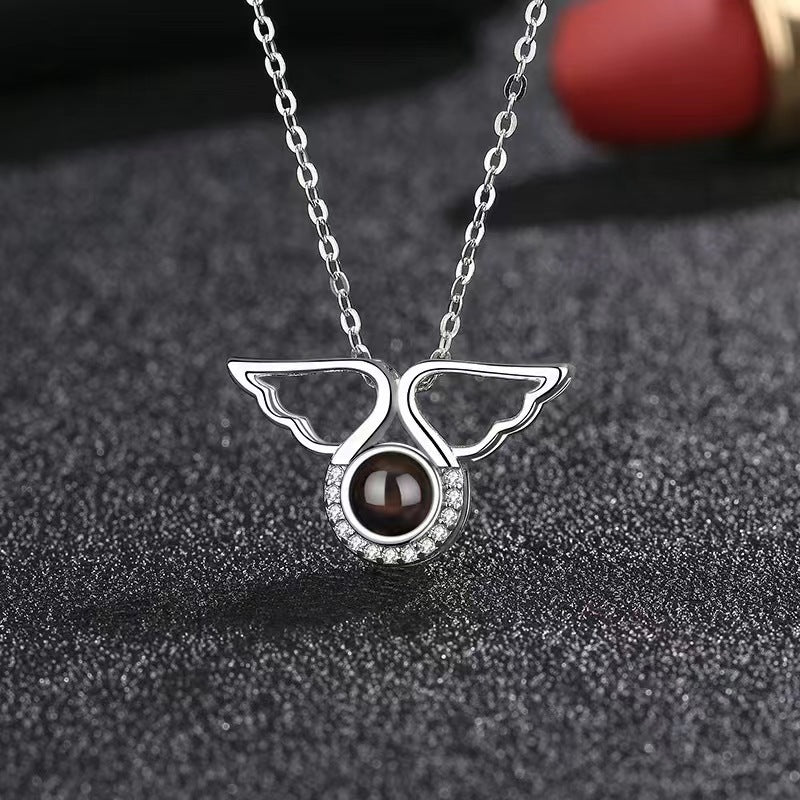 Customized angel wings projection necklace with 100 languages "I love you" and colorful photo.