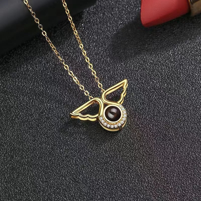 Customized angel wings projection necklace with 100 languages "I love you" and colorful photo.