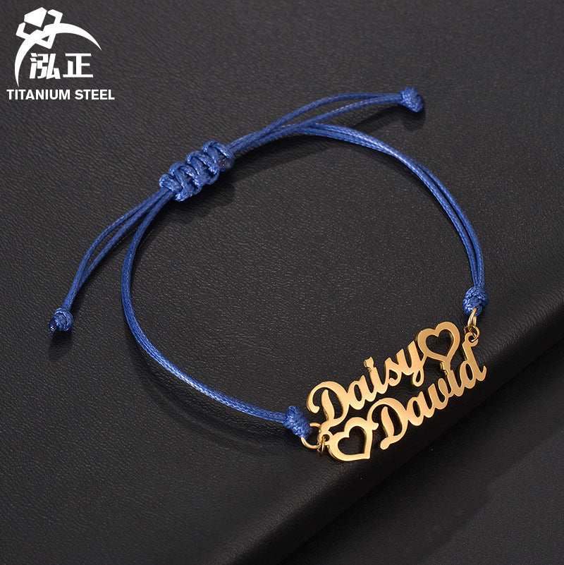 Custom stainless steel name bracelet with adjustable cord. Perfect for couples with personalized letter design.