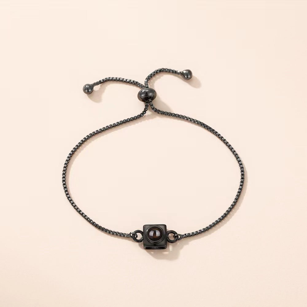 Trending square box sliding bracelet with photo projection and "I love you" in 100 languages.