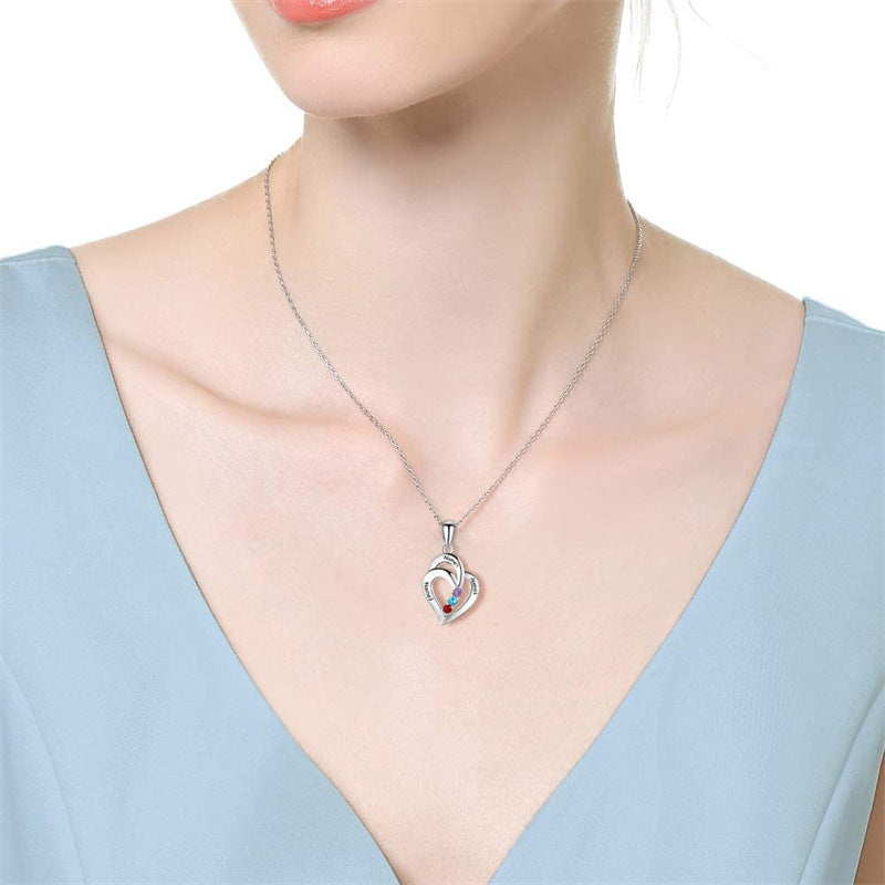 S925 sterling silver heart-shaped personalized name necklace with custom engraving and stone accents. Simple, elegant design perfect for gifts or daily wear.