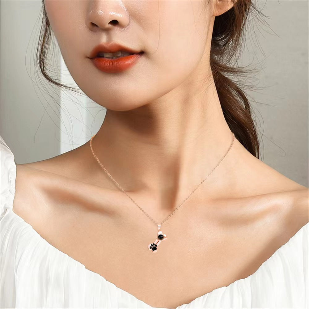 100 Languages "I Love You" projection bone necklace with dog paw design, perfect pet-themed Christmas gift.