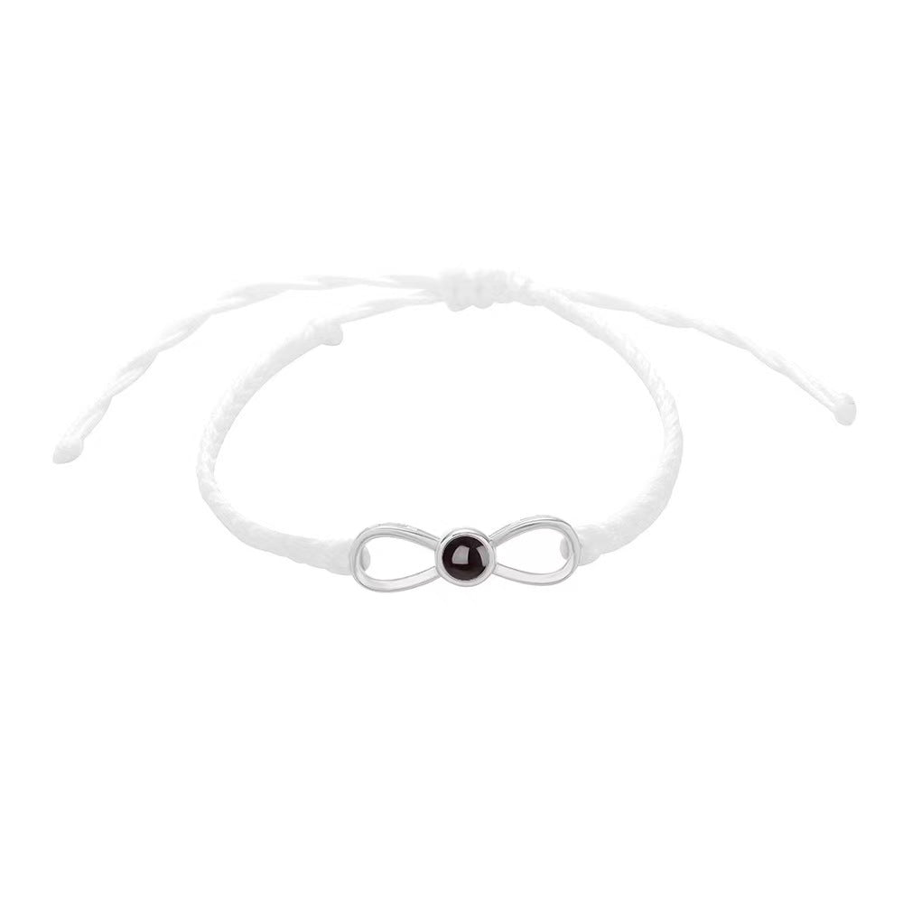 Korean-style bow braided bracelet with 100-language "I love you" photo projection, customizable for couples.
