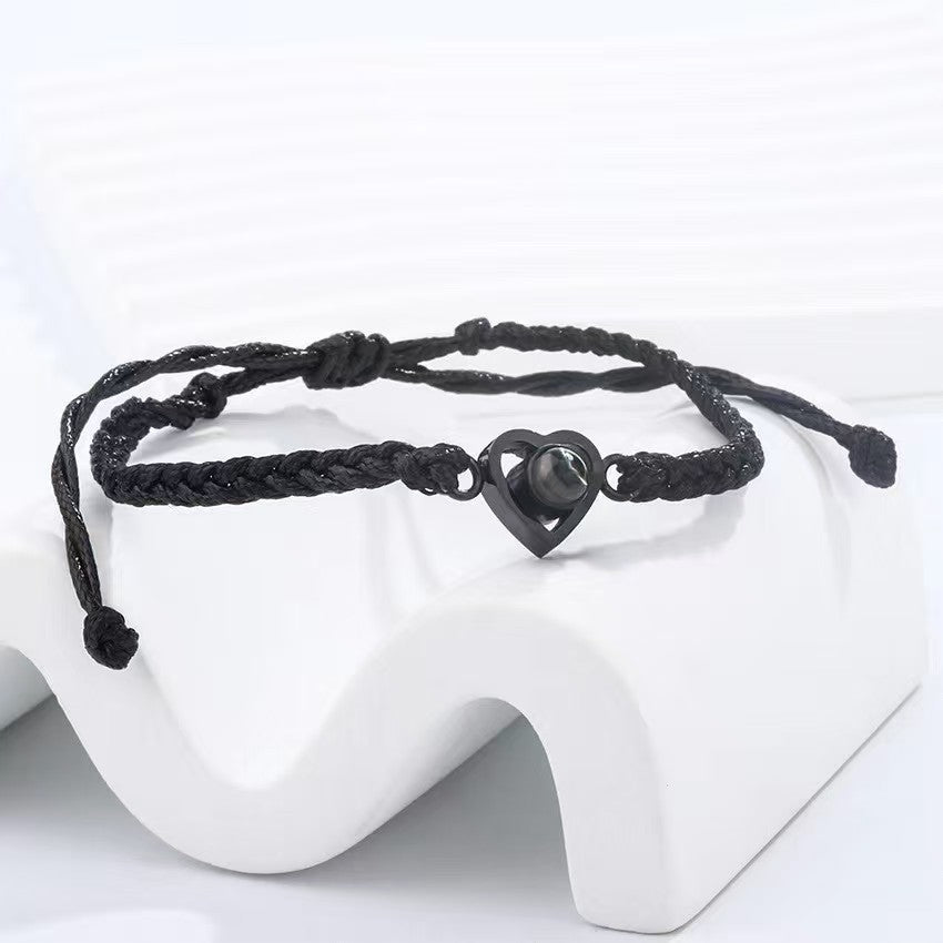 Popular heart woven bracelet with "I love you" in 100 languages projection, Korean-style minimalist design.