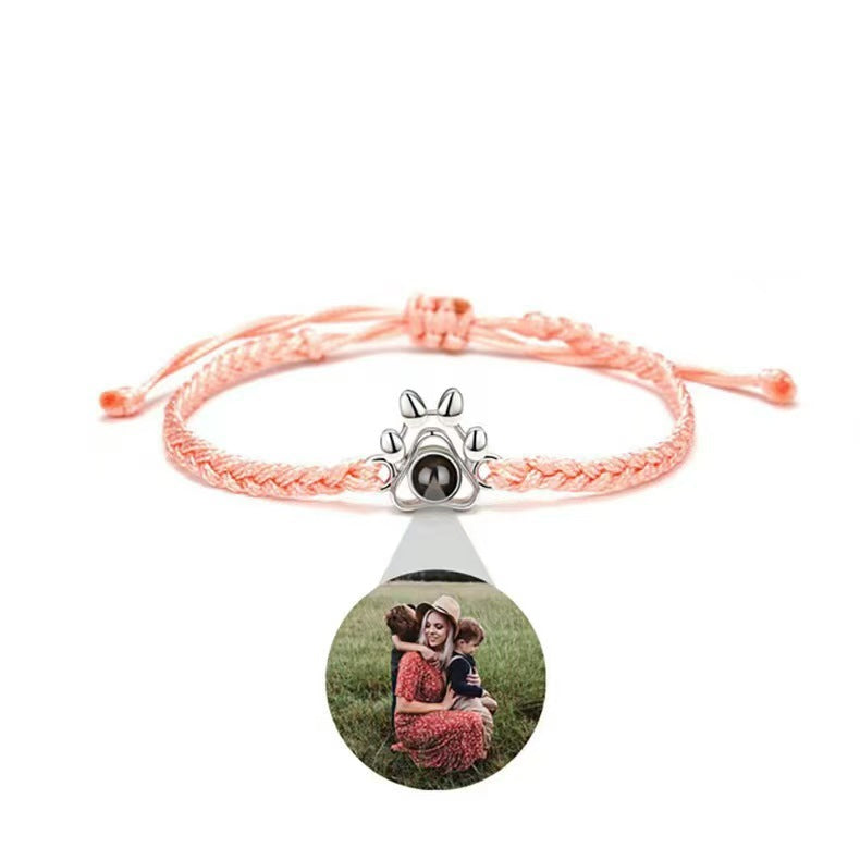 Dog paw projection bracelet for men and women, customizable with family photos and "I love you" in 100 languages.