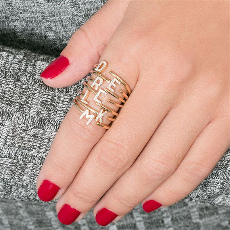 The initial explosion is 26 capital letters with diamonds, shiny and fashionable personalized opening ring.
