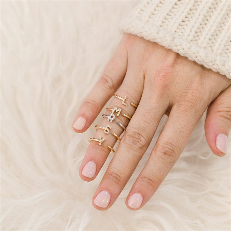 The initial explosion is 26 capital letters with diamonds, shiny and fashionable personalized opening ring.