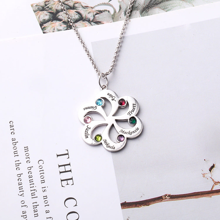 Custom silver necklace with geometric fan-shaped pendant featuring zodiac birthstones. Personalized 12 constellation jewelry. Perfect for gifting.