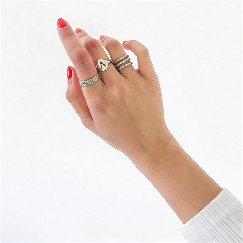 Hot-selling 925 silver letter ring with 18k gold plating. Non-fading, creative design.