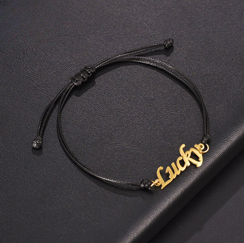 Custom stainless steel name bracelet with adjustable cord. Perfect for couples with personalized letter design.