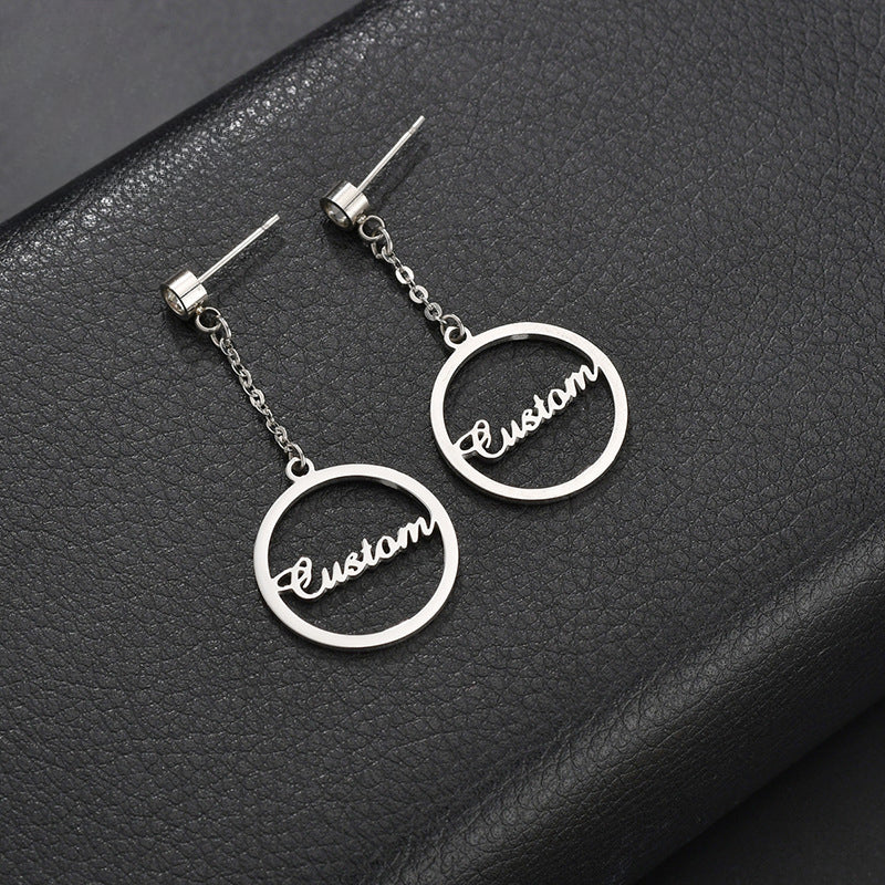 Trendy stainless steel letter name hoop earrings – bold and fashionable statement pieces.