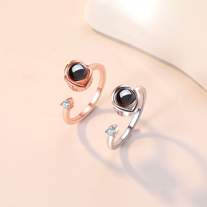 Custom projection couple rings for her feature "I Love You" in 100 languages. Adjustable open design, perfect as a memorable gift.