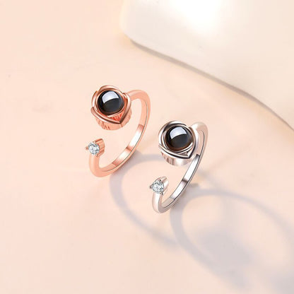 Custom projection couple rings for her feature "I Love You" in 100 languages. Adjustable open design, perfect as a memorable gift.