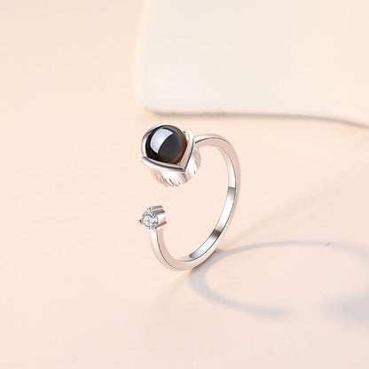 Custom projection couple rings for her feature "I Love You" in 100 languages. Adjustable open design, perfect as a memorable gift.