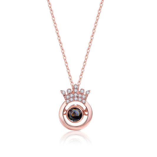 Custom Crown Pendant Necklace – "I Love You" in 100 languages, featuring a projection design with sparkling accents.