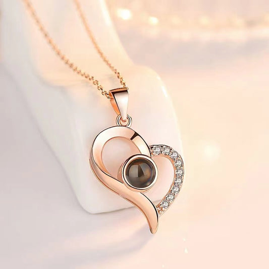Hot-selling "I Love You" projection necklace in 100 languages, TikTok-inspired slanted heart design, made from titanium steel for a chic collarbone chain.
