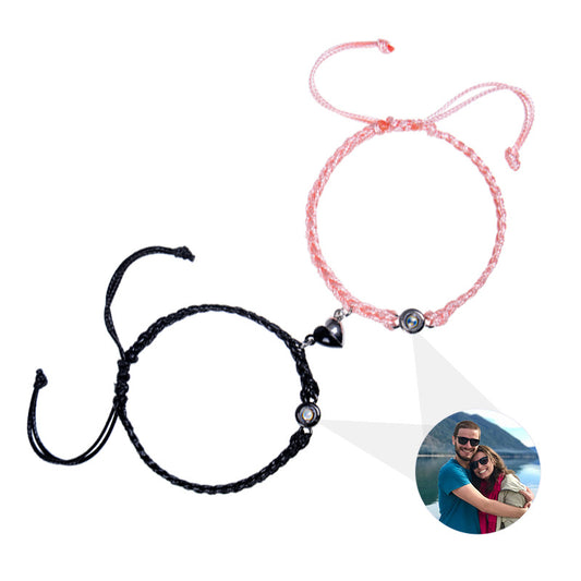 New '100 Languages I Love You' Projection Bracelet with heart-shaped magnetic clasp and braided rope design. Perfect couple's accessory.